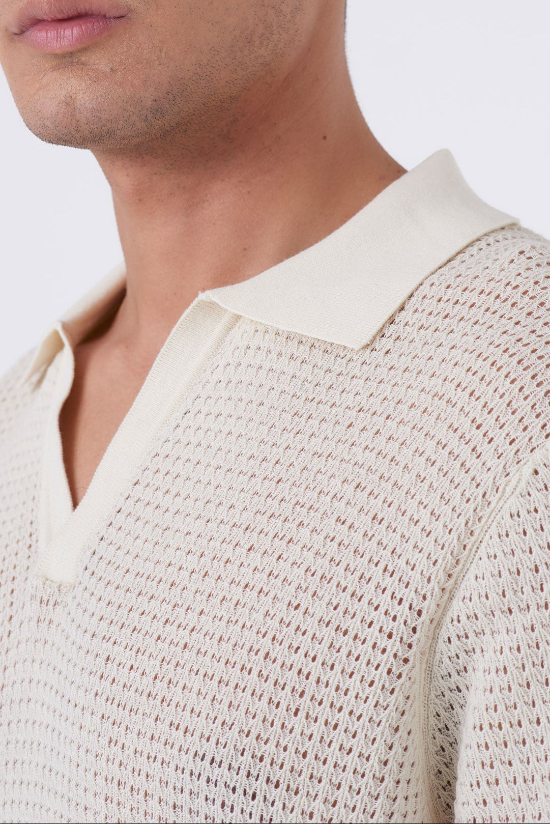 Polo traforata con collo bowling