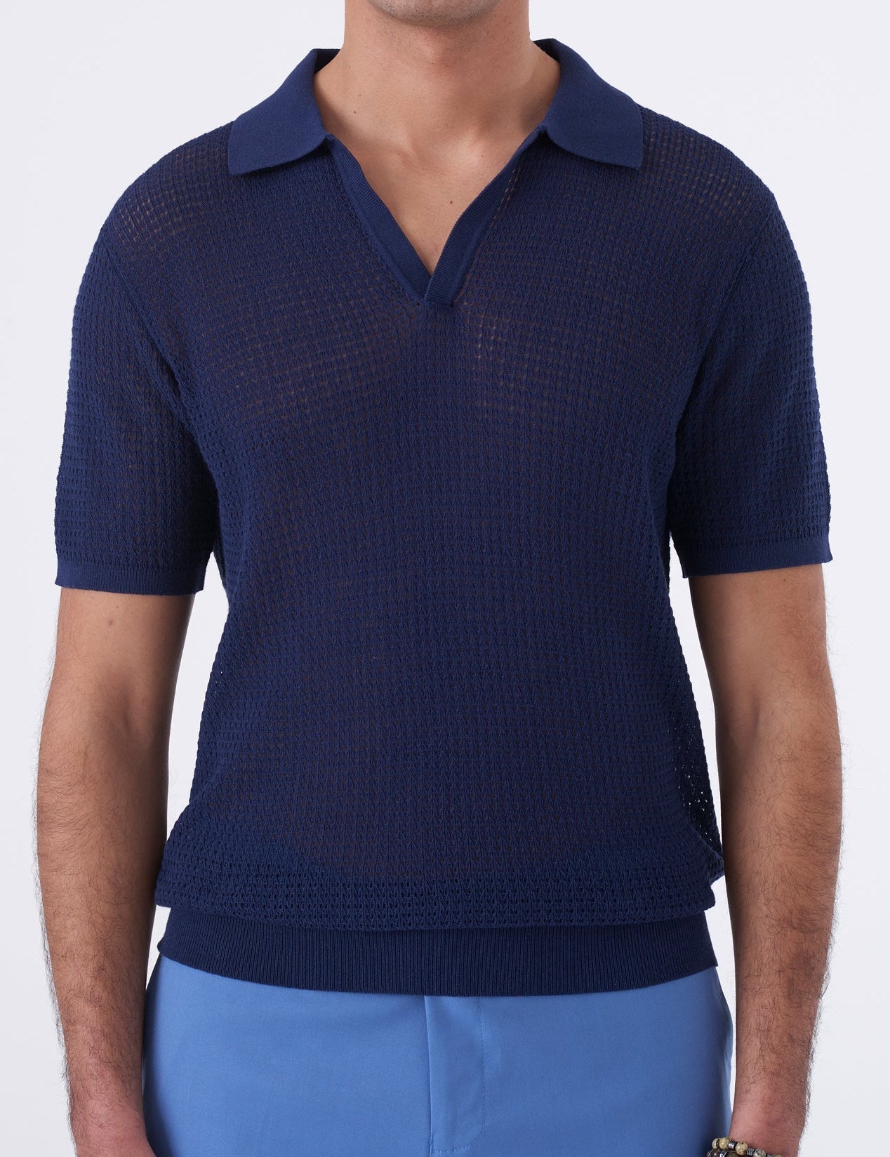 Polo traforata con collo bowling