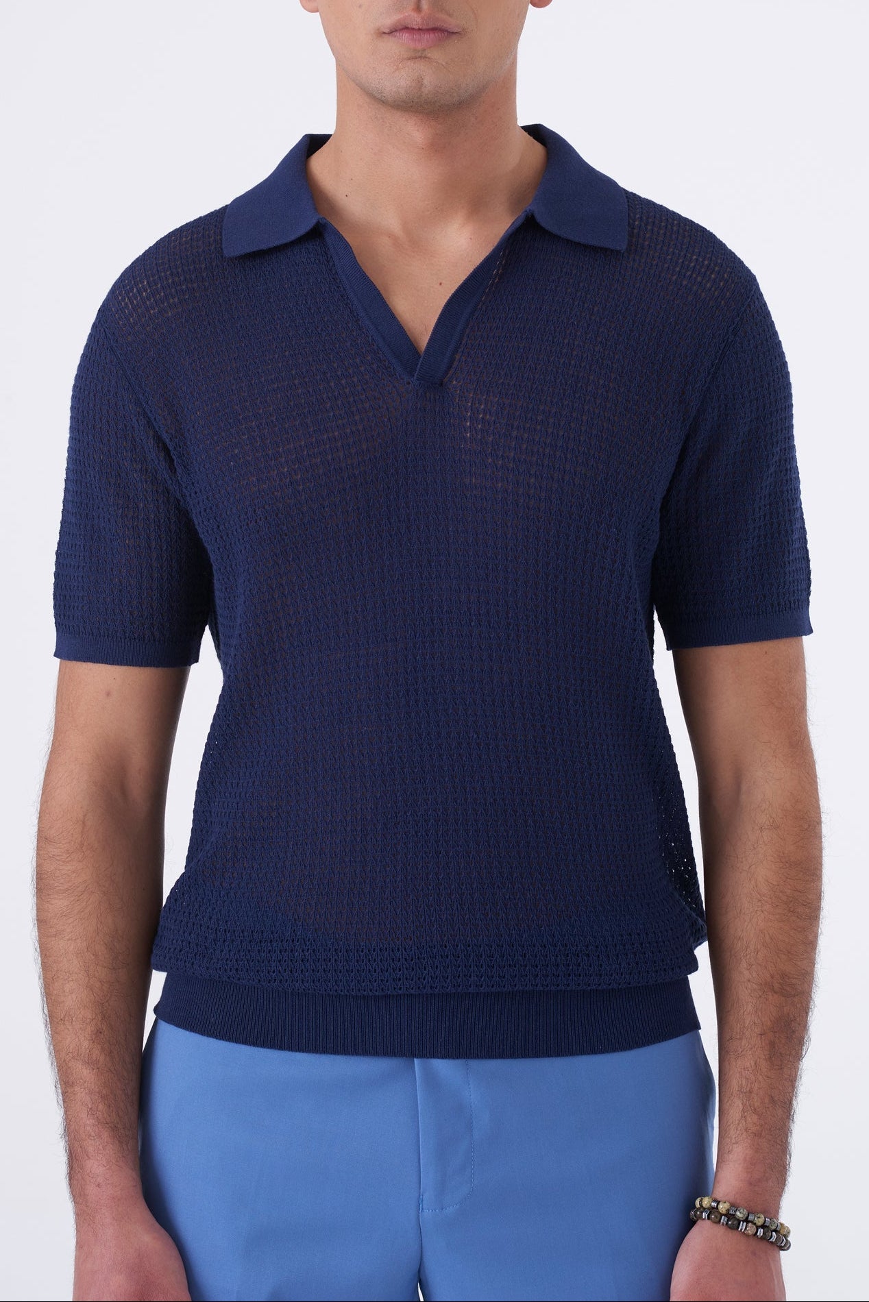 Polo traforata con collo bowling