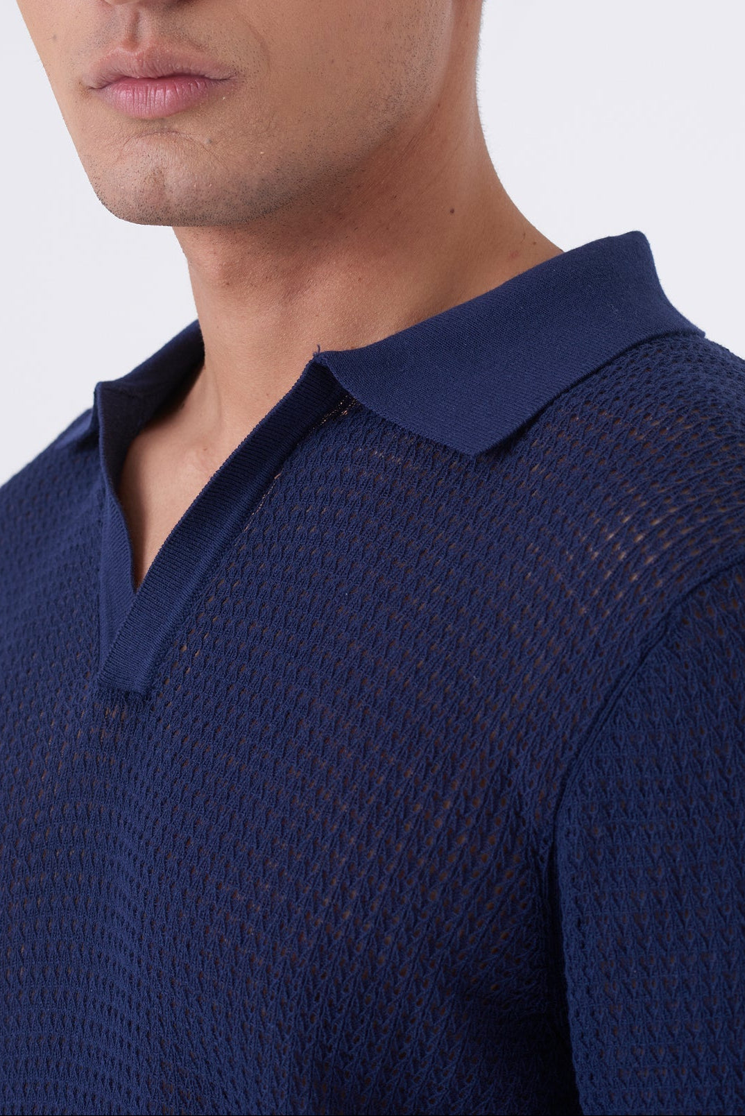 Polo traforata con collo bowling