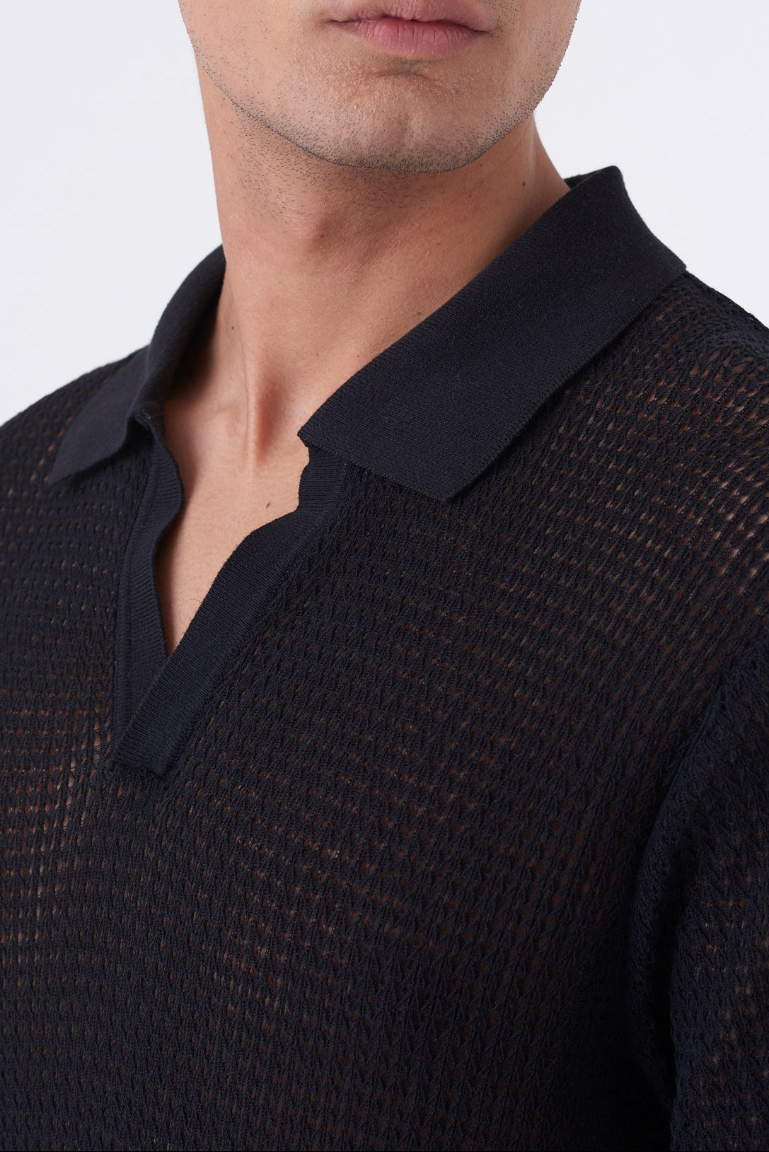 Polo traforata con collo bowling